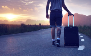 man with luggage on the road 